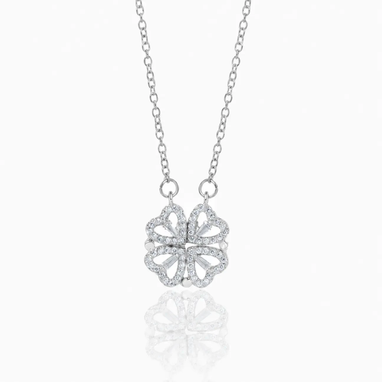 Silver clover necklace with four pavé heart leaves snapped together into a clover