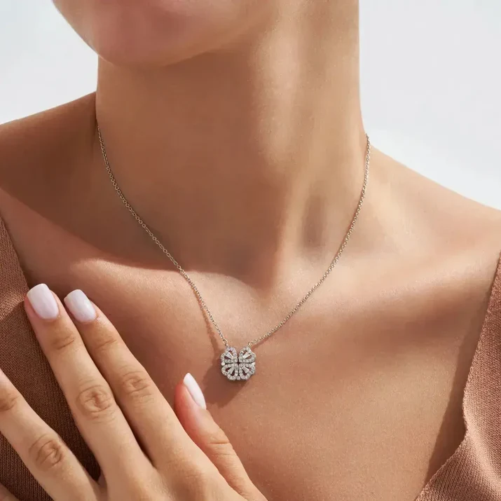 The clover necklace worn on a bare neckline