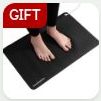 A black grounding mat with bare feet standing on it